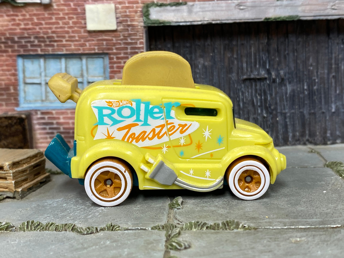Hot Wheels Roller Toaster yellow with turquoise and orange graphics, right side view