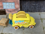 Hot Wheels Roller Toaster yellow with turquoise and orange graphics, top view