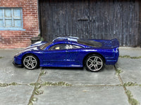 Hot Wheels Saleen S7 metallic blue and white, left side view with visible loose-car wear