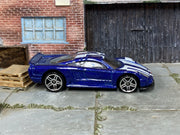 Hot Wheels Saleen S7 metallic blue and white, right side view with visible loose-car wear