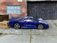 Hot Wheels Saleen S7 metallic blue and white, right side view with visible loose-car wear