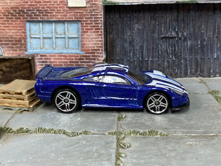 Hot Wheels Saleen S7 metallic blue and white, right side view with visible loose-car wear