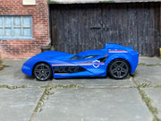 Hot Wheels Scoopa Di Fuego in blue police graphics, left side view