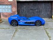 Hot Wheels Scoopa Di Fuego in blue police graphics, right side view