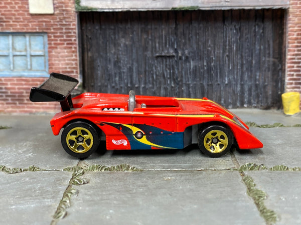 Hot Wheels Shadow Mk IIa red with blue and yellow graphics, right side view