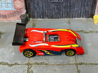 Hot Wheels Shadow Mk IIa red with blue and yellow graphics, top view