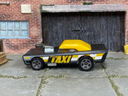 Hot Wheels Small Bloc black and yellow taxi, left side view