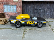 Hot Wheels Small Bloc black and yellow taxi, right side view