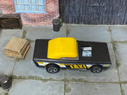 Hot Wheels Small Bloc black and yellow taxi, top view