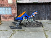 Hot Wheels Snow Ride blue number 5 miniature snowmobile with orange windshield, left side view