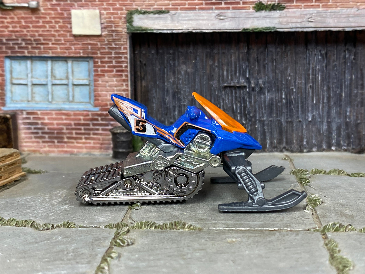 Hot Wheels Snow Ride blue number 5 miniature snowmobile with orange windshield, right side view