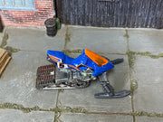 Hot Wheels Snow Ride blue number 5 miniature snowmobile with orange windshield, top view