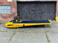Hot Wheels Solar Eagle III yellow and blue number 8 loose car, left side view