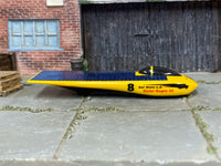 Hot Wheels Solar Eagle III yellow and blue number 8 loose car, right side view