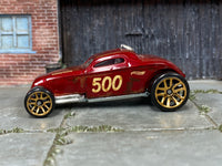 Hot Wheels Sooo Fast oxblood number 500 with weathered graphics, left side view
