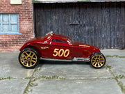 Hot Wheels Sooo Fast oxblood number 500 with weathered graphics, right side view