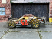 Clear number 68 Hot Wheels Stockar loose car, left side view
