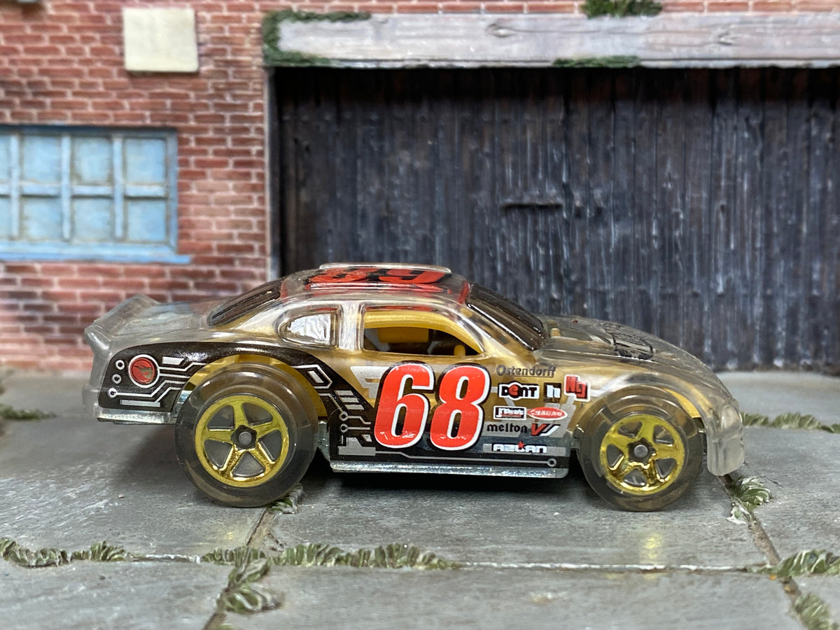 Clear number 68 Hot Wheels Stockar loose car, right side view