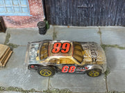 Clear number 68 Hot Wheels Stockar loose car, top view