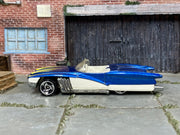 Hot Wheels Street Beast Swingfire blue and white, left-side view