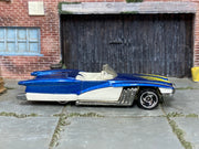 Hot Wheels Street Beast Swingfire blue and white, right-side view