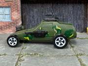 Hot Wheels Super Cannon olive camouflage with white five-spoke wheels, left side view