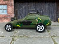 Hot Wheels Super Cannon olive camouflage with white five-spoke wheels, left side view