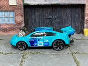 Hot Wheels Super Volt turquoise 2024 X6999 loose car, left-side view