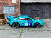 Hot Wheels Super Volt turquoise 2024 X6999 loose car, right-side view