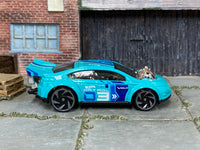Hot Wheels Super Volt turquoise 2024 X6999 loose car, right-side view