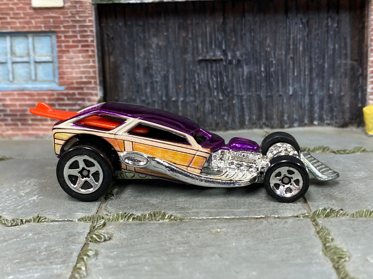 Hot Wheels Surf Crate purple with woodgrain graphics and orange-red surfboard, right side view