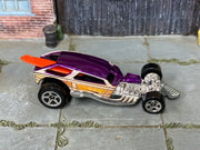 Hot Wheels Surf Crate purple with woodgrain graphics and orange-red surfboard, top view