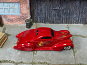 Hot Wheels Swoop Coupe metallic red with yellow and silver graphics, top view