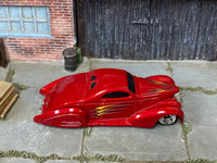 Hot Wheels Swoop Coupe metallic red with yellow and silver graphics, top view