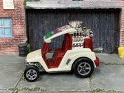 Hot Wheels Tee'd Off pearl white with burgundy interior — left side view