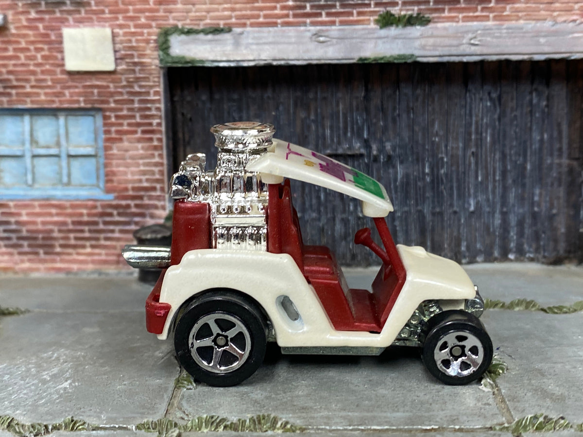 Hot Wheels Tee'd Off pearl white with burgundy interior — right side view