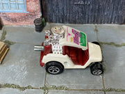 Hot Wheels Tee'd Off pearl white with burgundy interior — top view