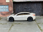 Hot Wheels Tesla Model 3 pearl white loose car, left side view