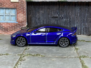 Hot Wheels Tesla Model S Plaid metallic dark blue loose car, left side view