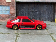 Hot Wheels Toyota AE86 Sprinter Trueno red with black stripes, right side view