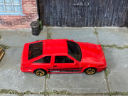 Hot Wheels Toyota AE86 Sprinter Trueno red with black stripes, top view