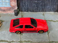 Hot Wheels Toyota AE86 Sprinter Trueno red with black stripes, top view