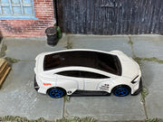 Hot Wheels Toyota Prius Custom pearl white with blue wheels, top view