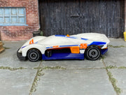 Hot Wheels Turbine Sublime white and blue 55, left side view showing loose-car wear