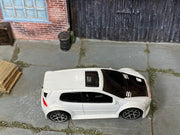 Hot Wheels Volkswagen Golf GTI pearl white with black hood, top view