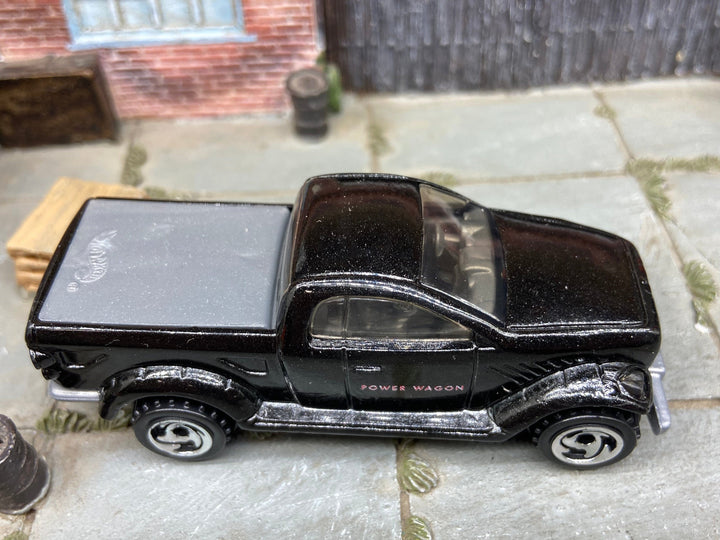 Loose Hot Wheels Dodge Power Wagon 4x4 Truck In Black and Pink — view 2