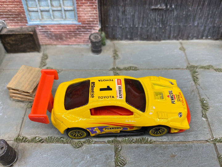 Loose Hot Wheels Pikes Peak Toyota Celica Race Car - Penzoil Yellow — view 2