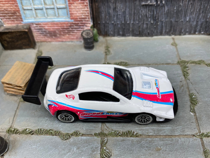 Loose Hot Wheels Pikes Peak Toyota Celica Race Car - White, Pink and Blue SweetTarts — view 2