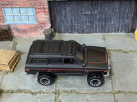 Loose Hot Wheels - 1988 Jeep Wagoneer - Satin Black and Red — view 2