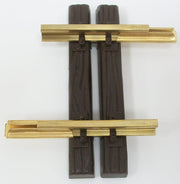 Single LGB 10050 52 mm straight track section with two dark ties and brass-colored rails.